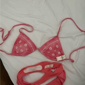 Tags still on Aerie pink bikini set; never worn. Top size M and bottoms size S.